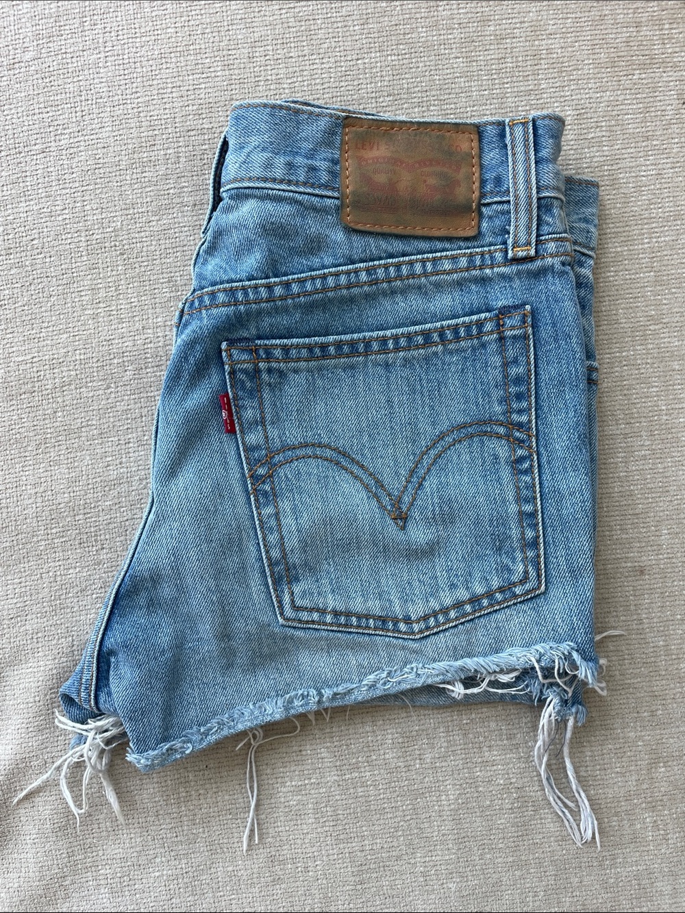 Levi's Light Blue Frayed Denim Cutoff Shorts